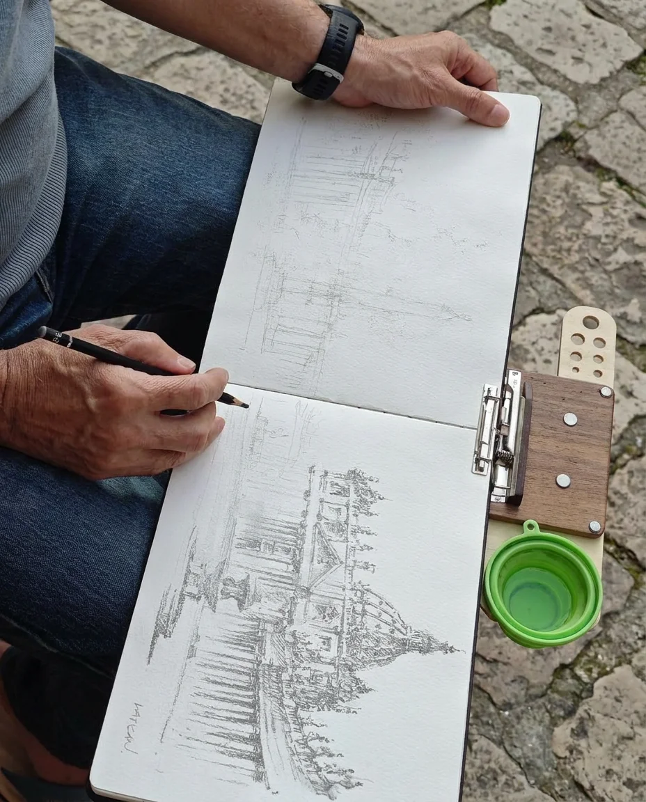 Sketching a domed cathedral on a PleinWing easel, pencil in hand
